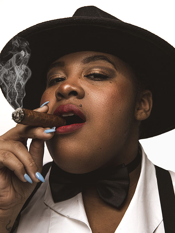 Portrait of a women smoking a cigar