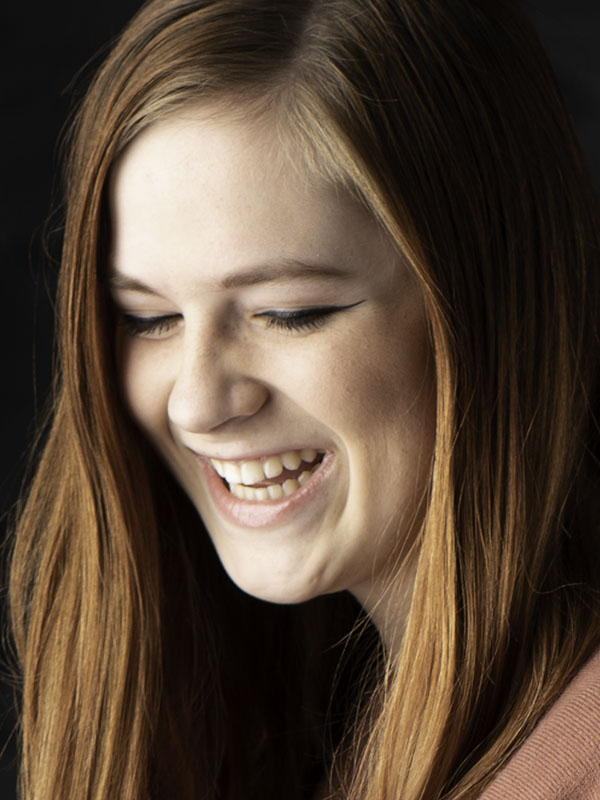 female redhead laughing portrait